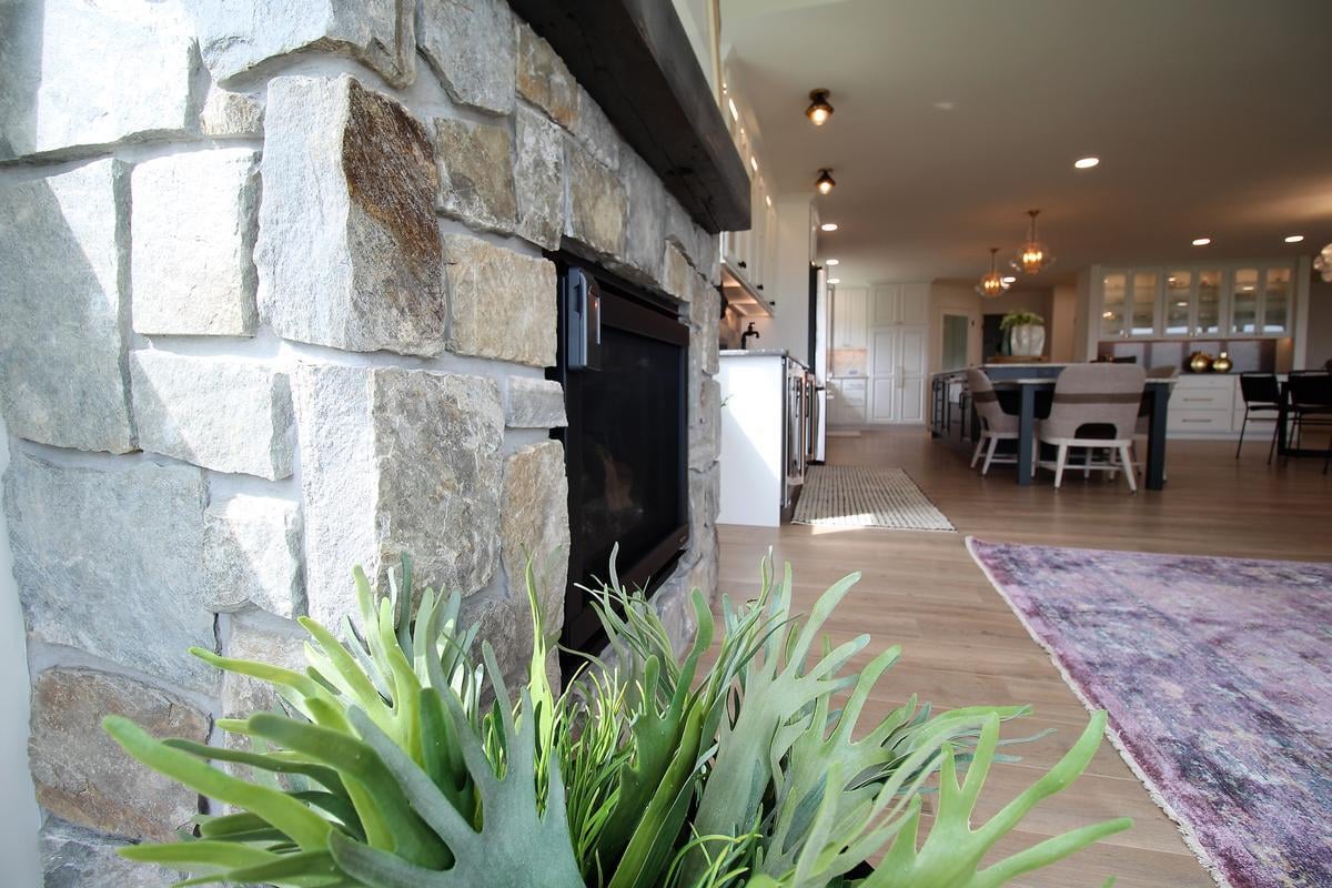 Close-up of stone fireplace design in a Ross Construction custom home in Lake Dubay, WI.