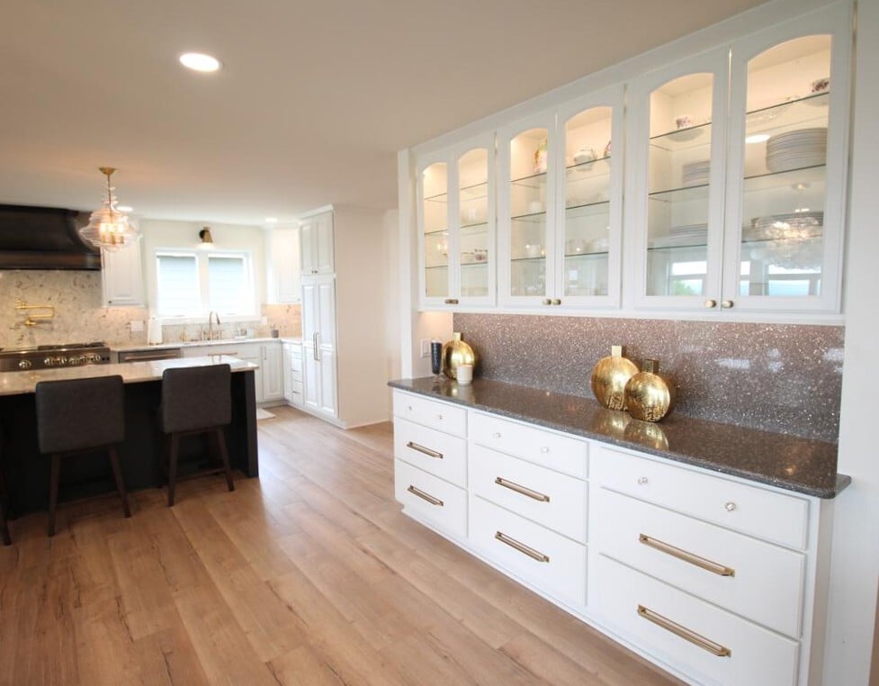 Elegant kitchen buffet with glass-front cabinets in a Ross Construction custom home in Wausau, WI.