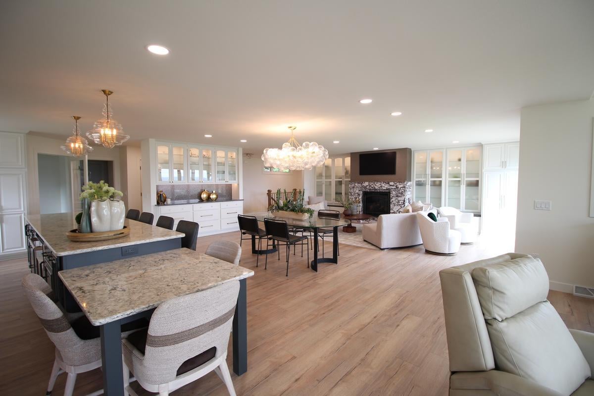 Open-concept living, dining, and kitchen space in a Ross Construction custom home in Lake Dubay, WI.
