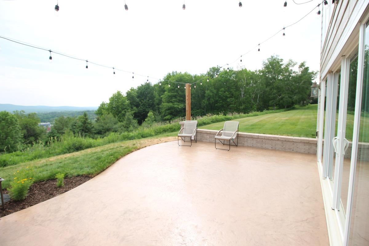 Scenic backyard entertaining space in custom home by Ross Construction in Rib Mountain, WI