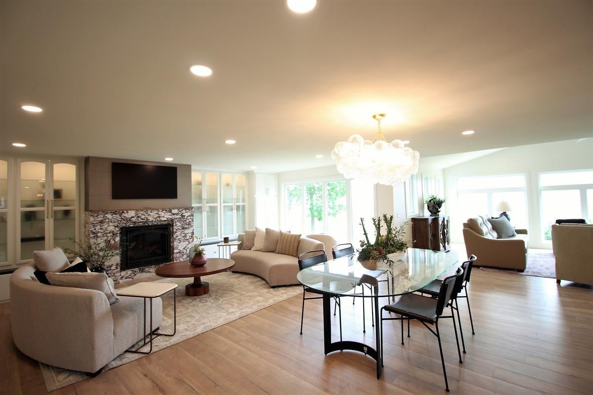 Spacious custom home living area by Ross Construction, featuring modern furniture and large windows in Wausau, WI.