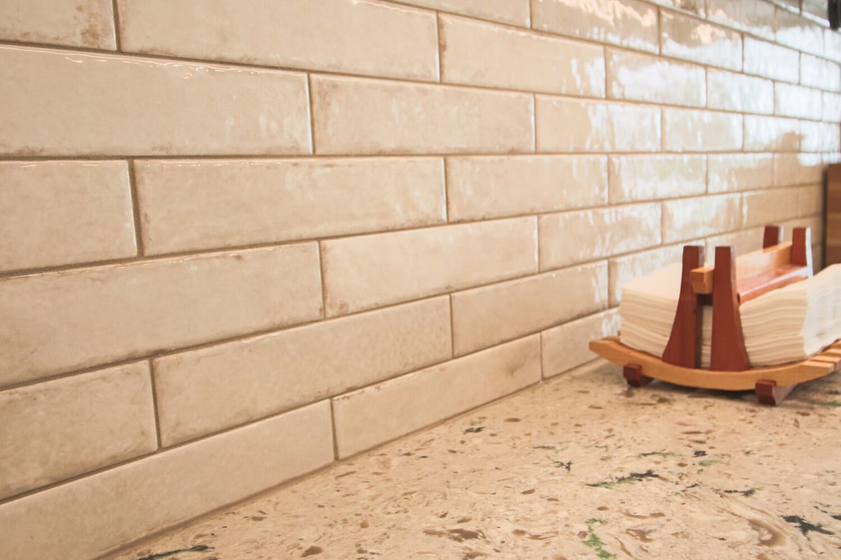 Close-up of glazed subway tile backsplash in Marathon custom kitchen by Ross Construction.