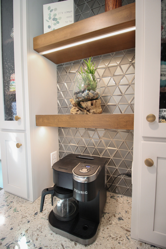 Coffee station nook with Keurig and geometric tile backsplash in Marathon custom home by Ross Construction.