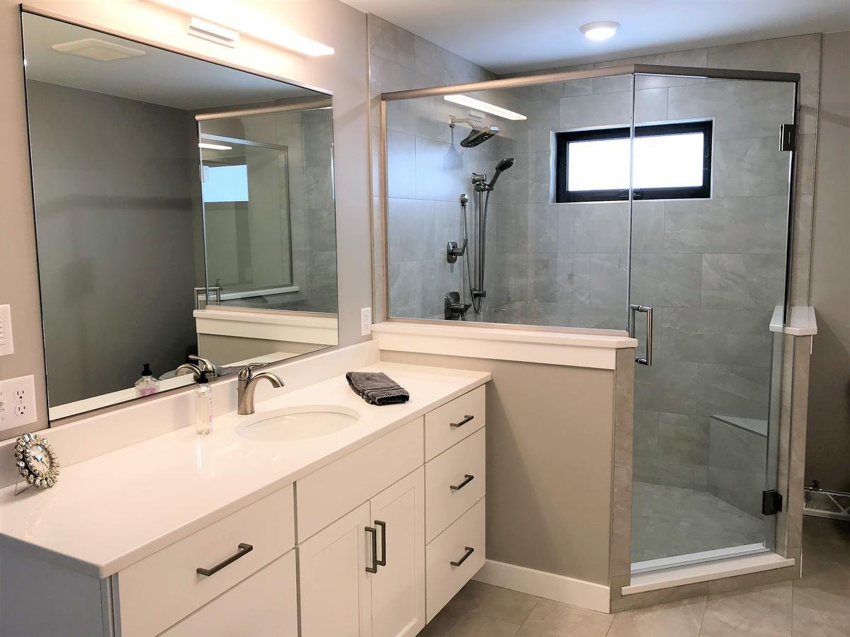 Ross Construction-designed master bathroom in Marathon, WI with glass shower and single sink vanity.