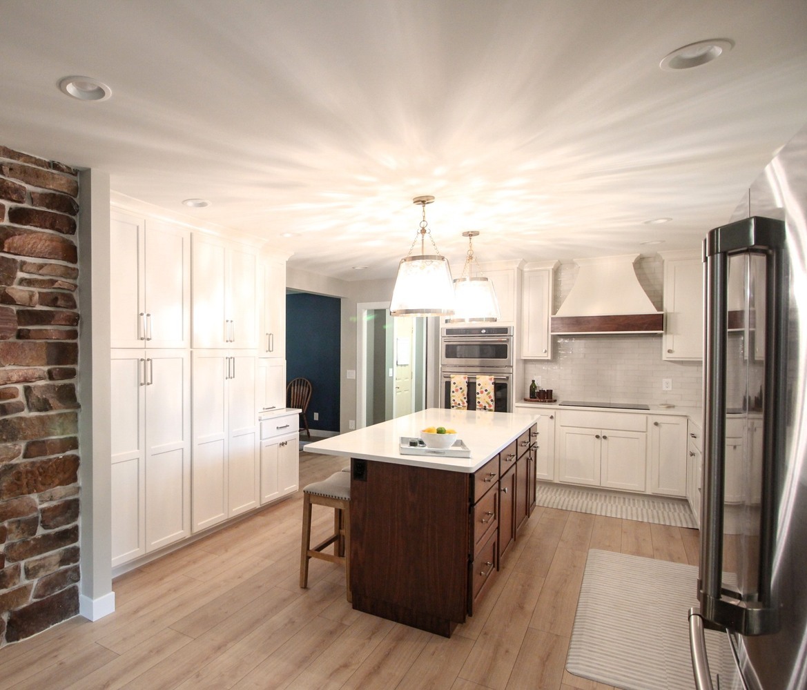 Spacious kitchen remodel with a large island and pendant lighting by Ross Construction in Marathon, WI.