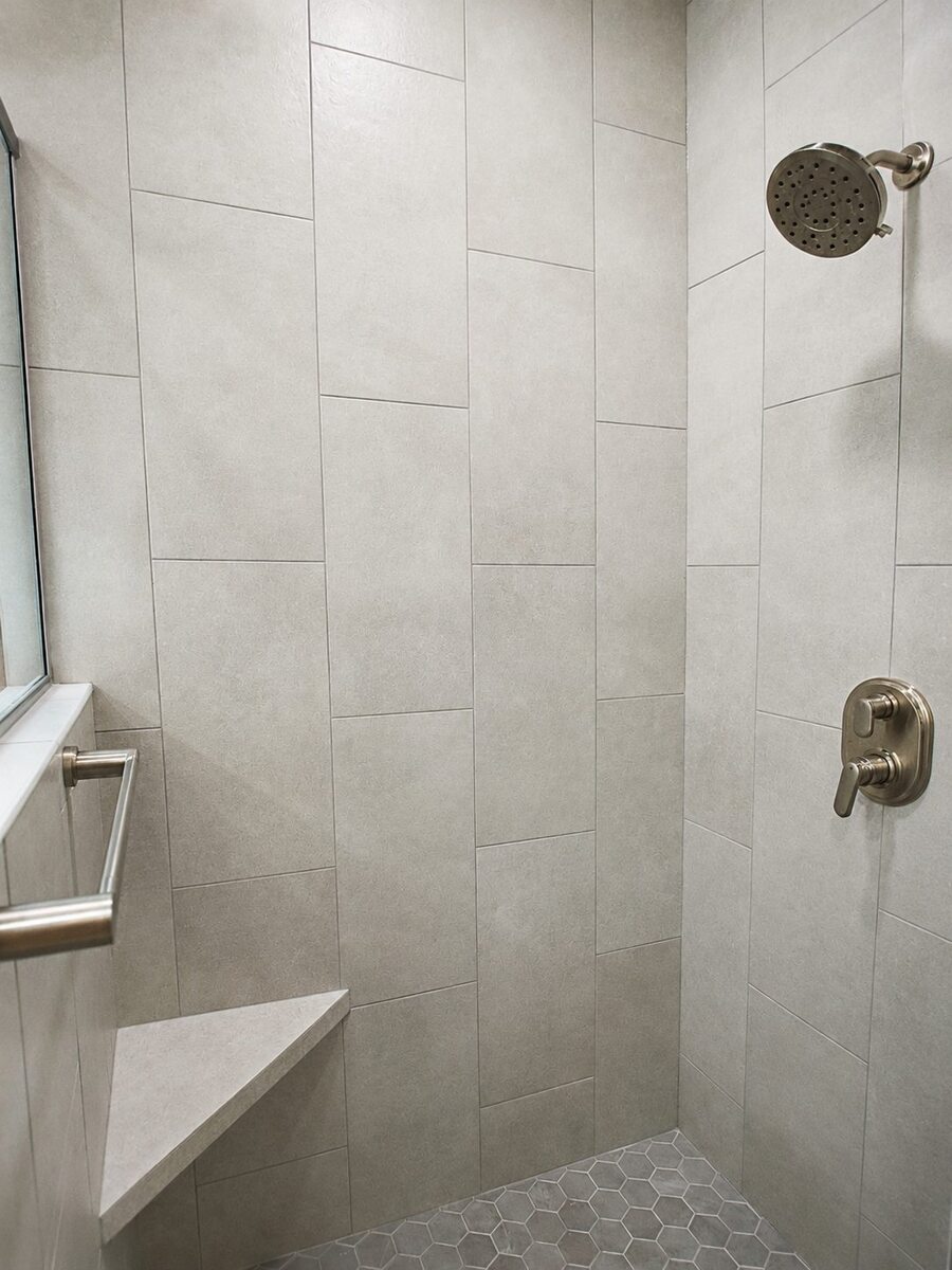 primary-bathroom-remodel-tiled-shower-with-corner-bench-minocqua-wi