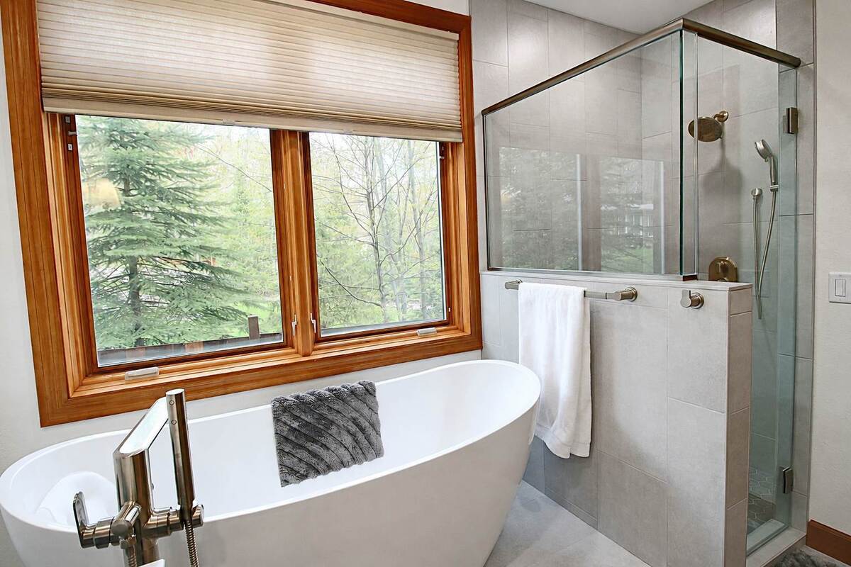 primary-bathroom-remodel-tub-by-window-and-shower-knee-wall-minocqua-wi