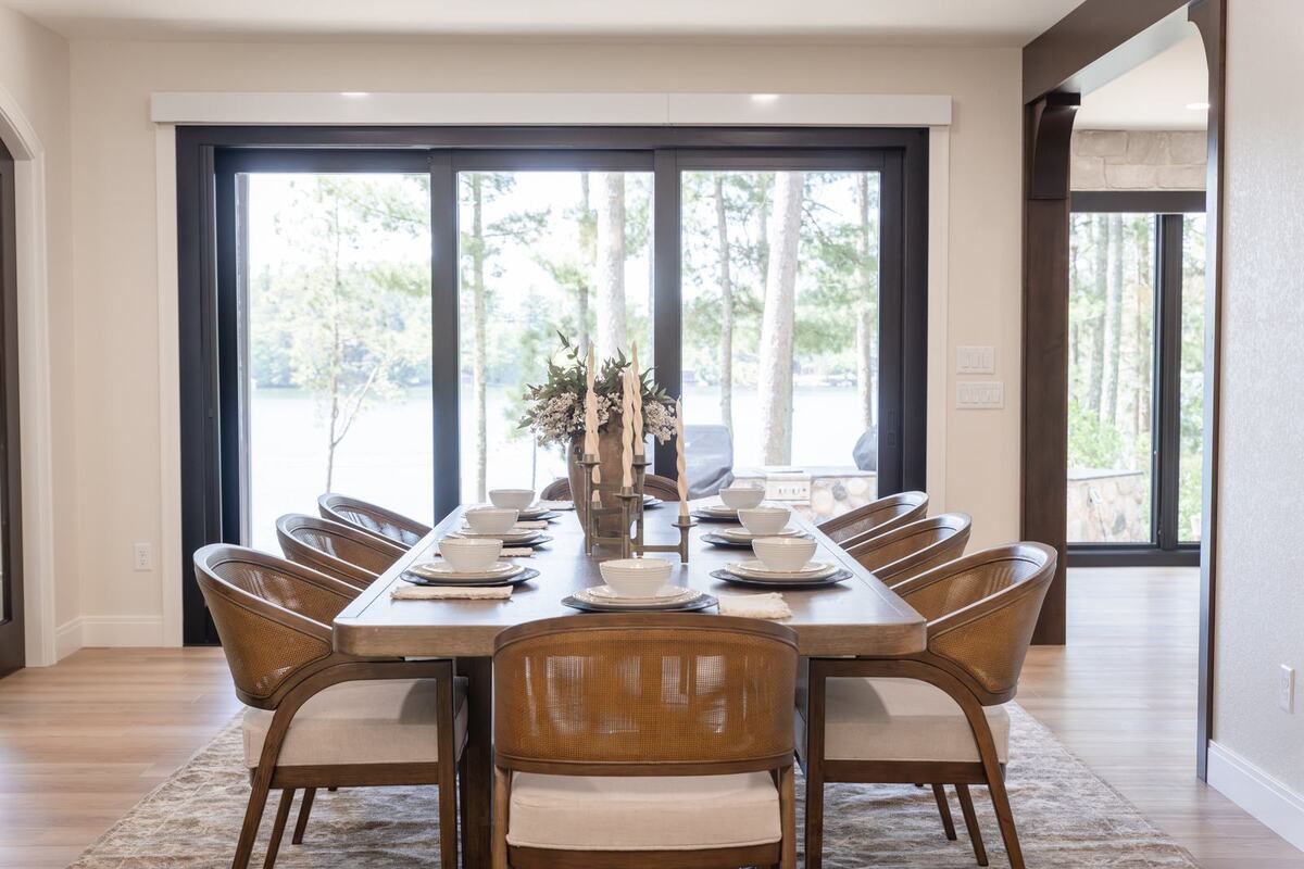 whole home remodel dining table with lake view sliding doors minocqua wi