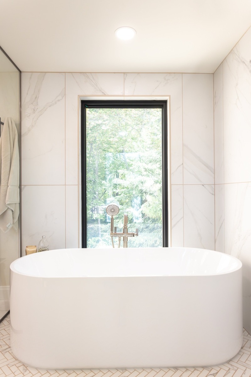 whole home remodel freestanding soaking tub with picture window minocqua wi