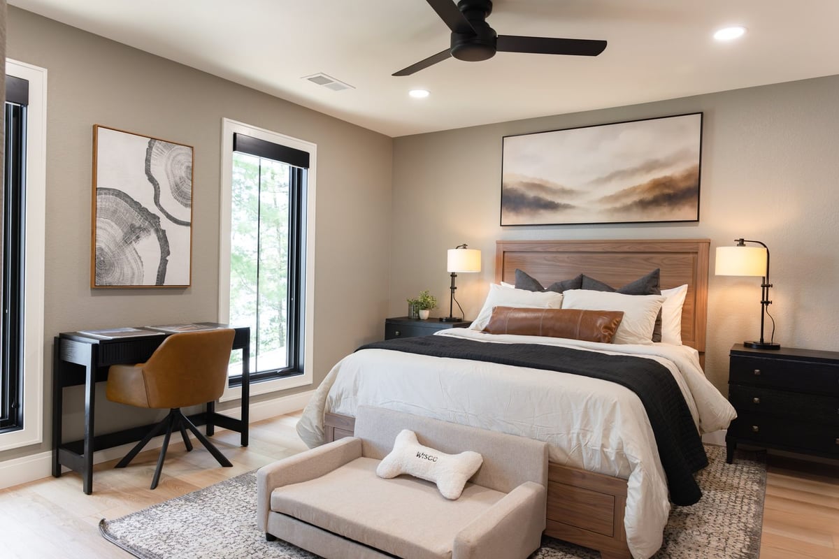 whole home remodel guest bedroom with walnut bed and desk angled view minocqua wi