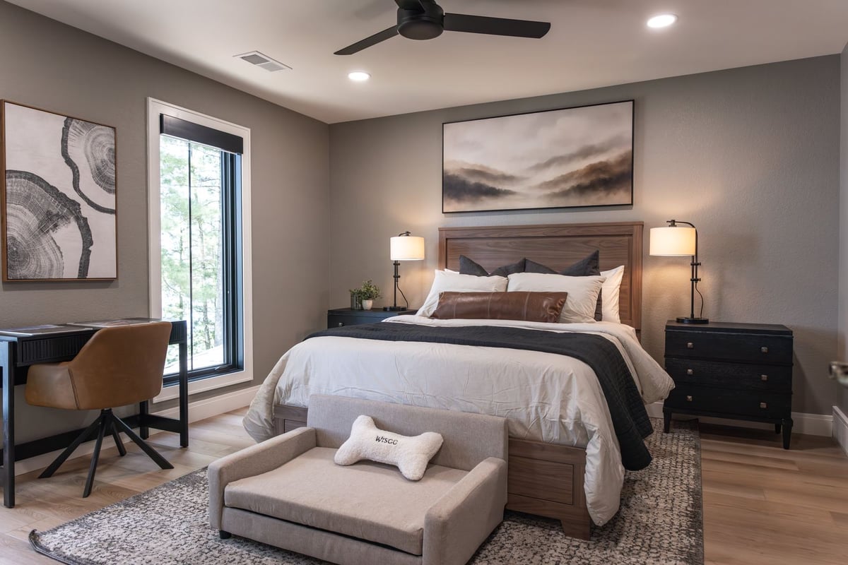 whole home remodel guest bedroom with walnut bed and desk wide view minocqua wi