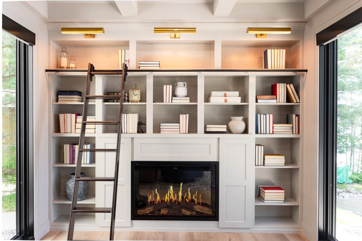 whole home remodel library bookshelves with fireplace and rolling ladder minocqua wi