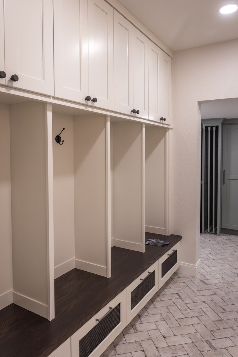 whole home remodel mudroom lockers with bench and herringbone brick floor minocqua wi