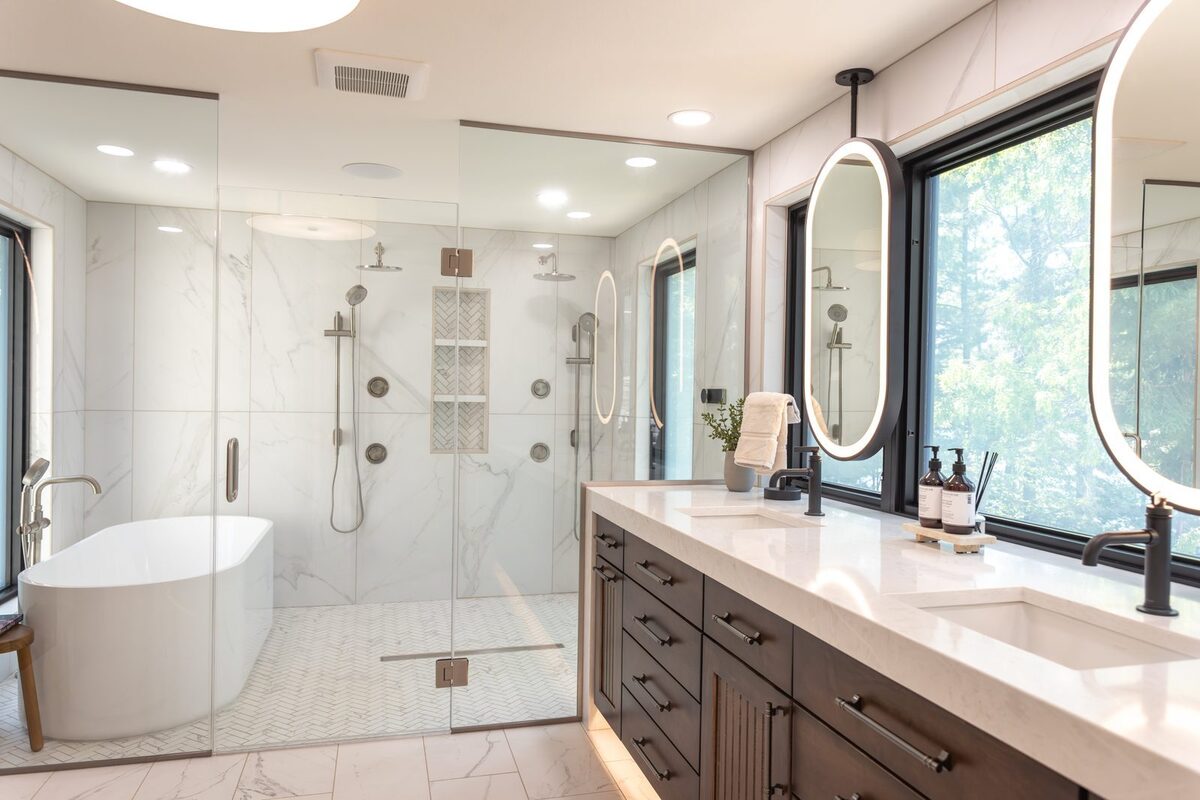 whole home remodel primary bathroom with glass wet room and double vanity minocqua wi
