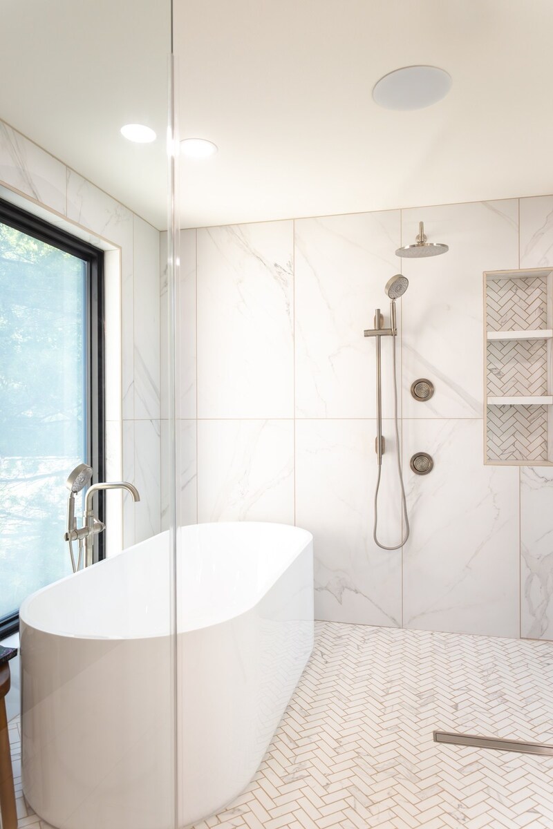 whole home remodel wet room soaking tub and herringbone tile floor minocqua wi
