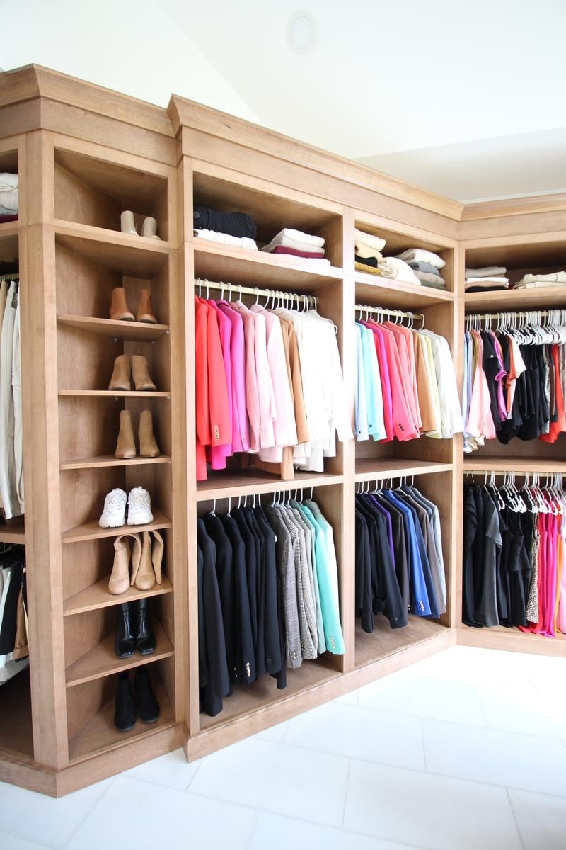 Built-in wardrobe with shelves and hangers for neatly arranged clothing by Ross Construction in Wausau, WI