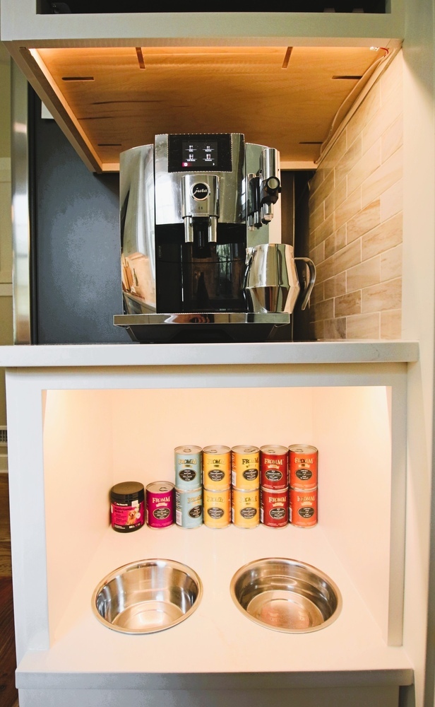 Built-in coffee bar with dog feeding station in Ross Construction custom kitchen in Wausau, WI.