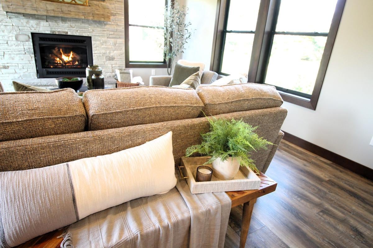 Fireplace and cozy seating decor in Rib Mountain, WI custom home by Ross Construction.