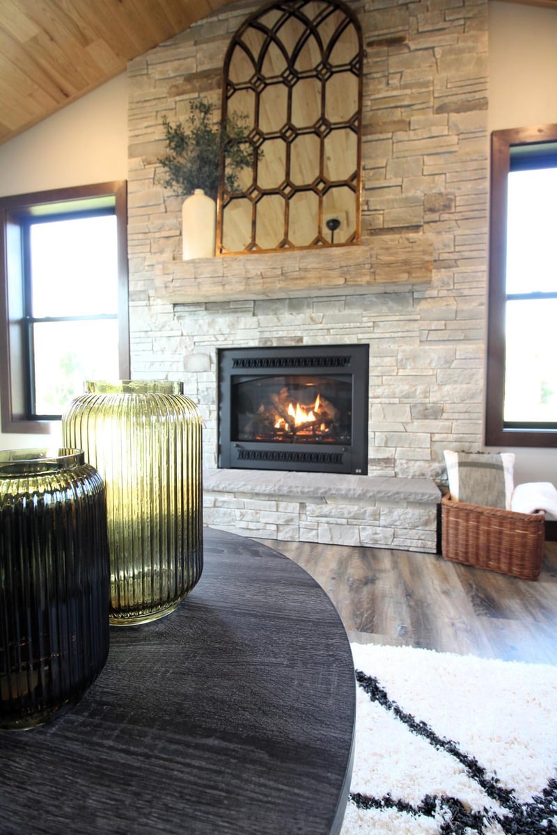 Ross Construction fireplace vignette in Rib Mountain, WI custom home with warm tones and modern decor.