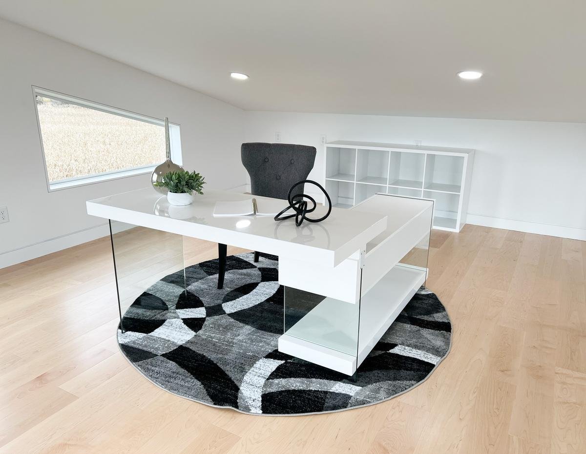 Custom loft office with modern desk and open shelving in Rib Mountain, WI home by Ross Construction.