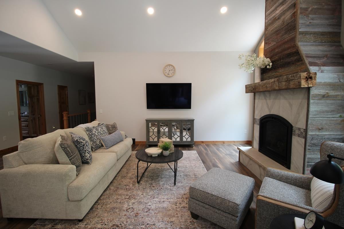 Cozy living room with fireplace in a Marathon, WI custom home built by Ross Construction.