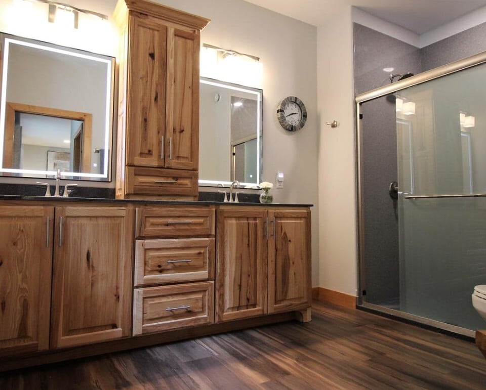 Double vanity and walk-in shower in a custom bathroom by Ross Construction in Rib Mountain, WI.