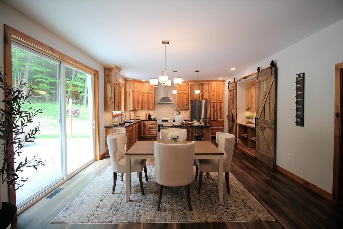Open-concept dining and kitchen space in a Rib Mountain, WI custom home by Ross Construction.