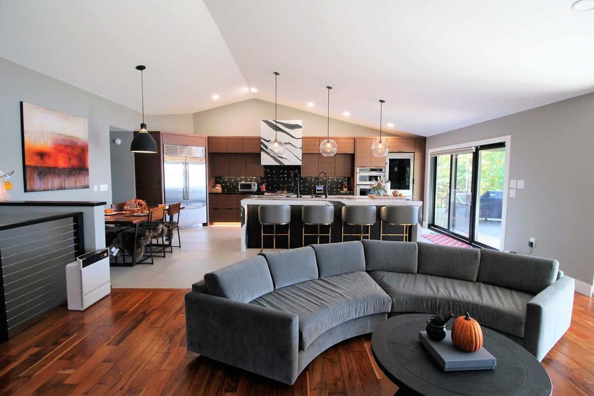 Modern open-concept kitchen and living room in a custom home by Ross Construction in Wausau, WI.