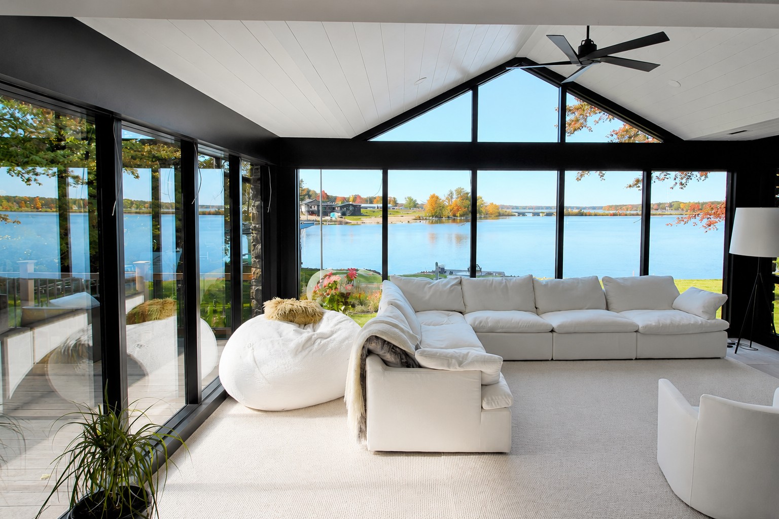 Waterfront sitting area with scenic views in a custom Rib Mountain, WI home by Ross Construction.