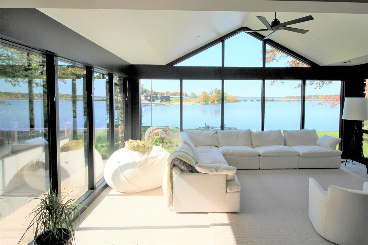 Waterfront sitting area with scenic views in a custom Rib Mountain, WI home by Ross Construction.
