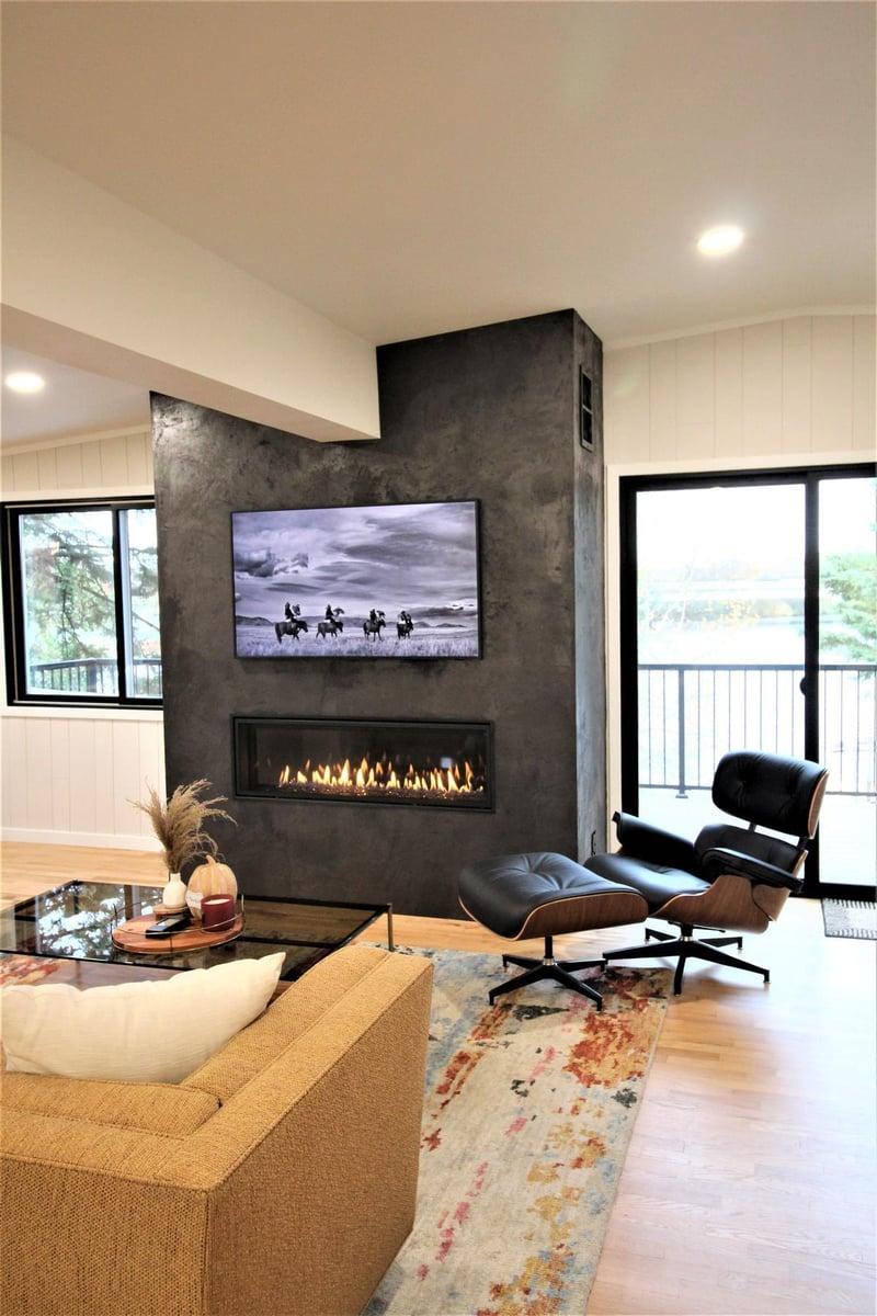 Modern fireplace and lounge area in a Wausau custom home designed by Ross Construction.