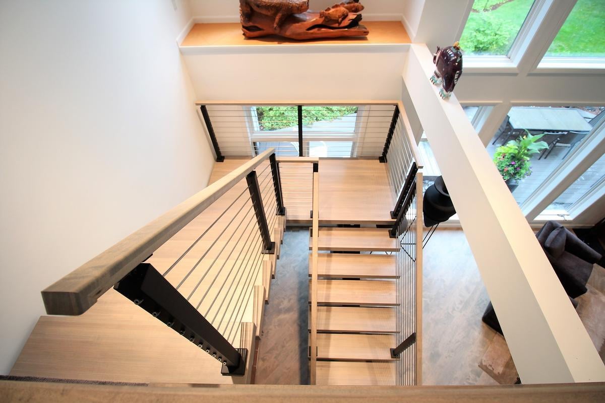 Upper-level view overlooking luxury living space in Lake Dubay custom home by Ross Construction.