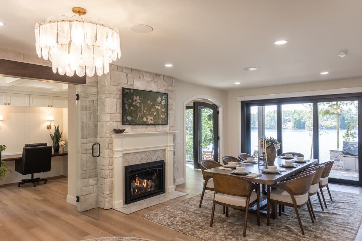 whole home remodel dining room and home office with glass door and stone fireplace minocqua wi