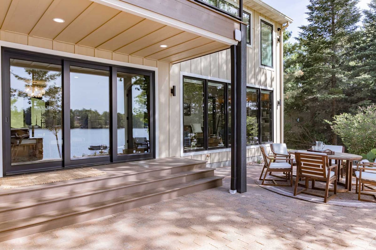 whole home remodel exterior covered lakeside patio with sliding doors minocqua wi