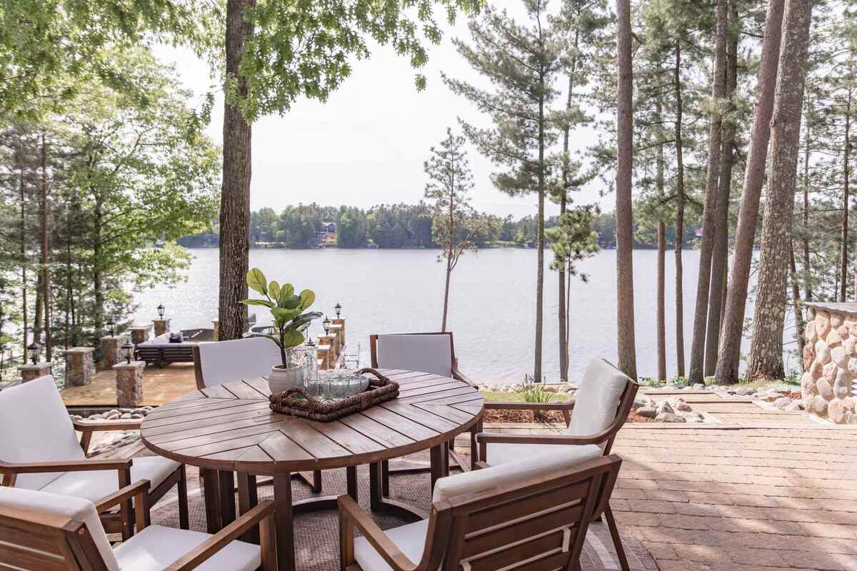 whole home remodel exterior lakeside patio dining table with lake view minocqua wi