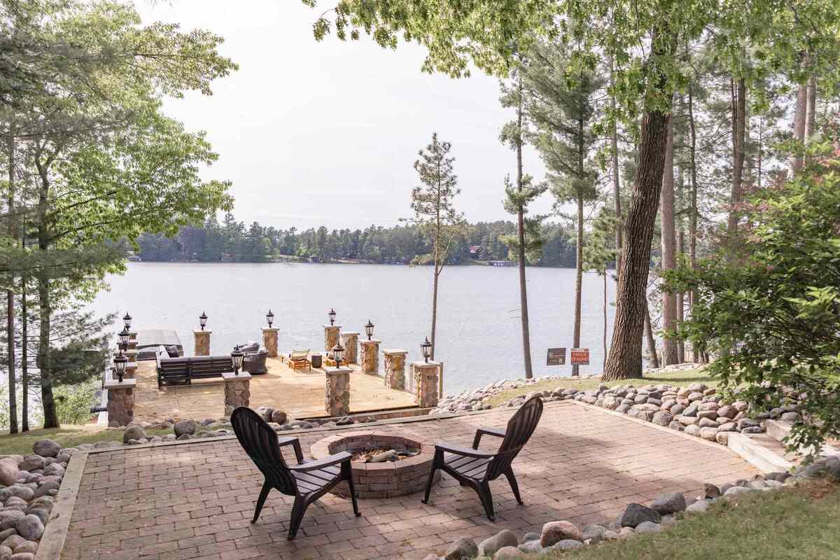 whole home remodel exterior lakeside paver patio with fire pit minocqua wi