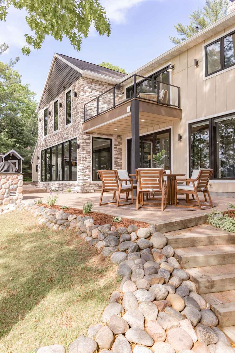 whole home remodel exterior rear patio steps and balcony wide view minocqua wi
