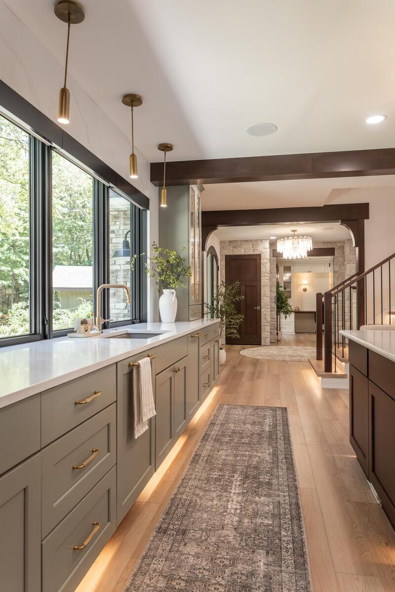 whole home remodel kitchen sink wall with brass pendants and toe kick lighting minocqua wi