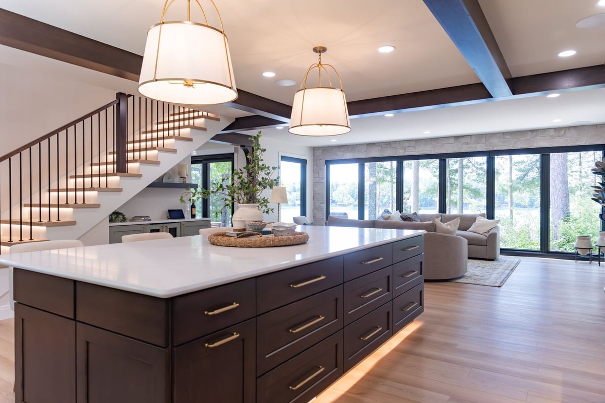 whole home remodel kitchen walnut island with drum pendants and staircase wide view minocqua wi