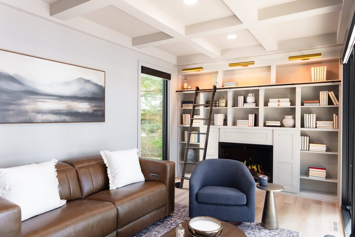 whole home remodel library with landscape artwork and rolling ladder minocqua wi