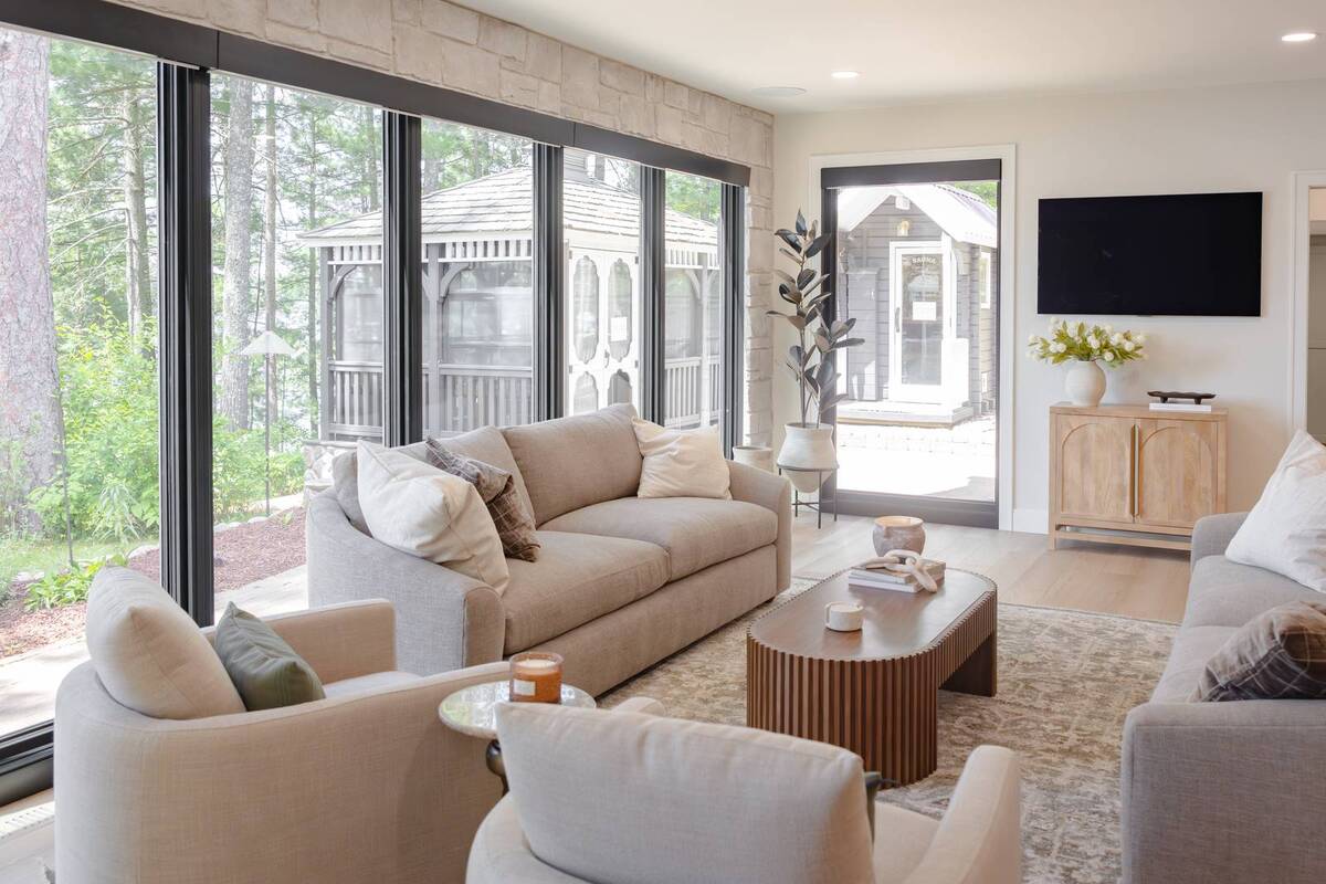 whole home remodel living room with fluted coffee table and view to gazebo minocqua wi