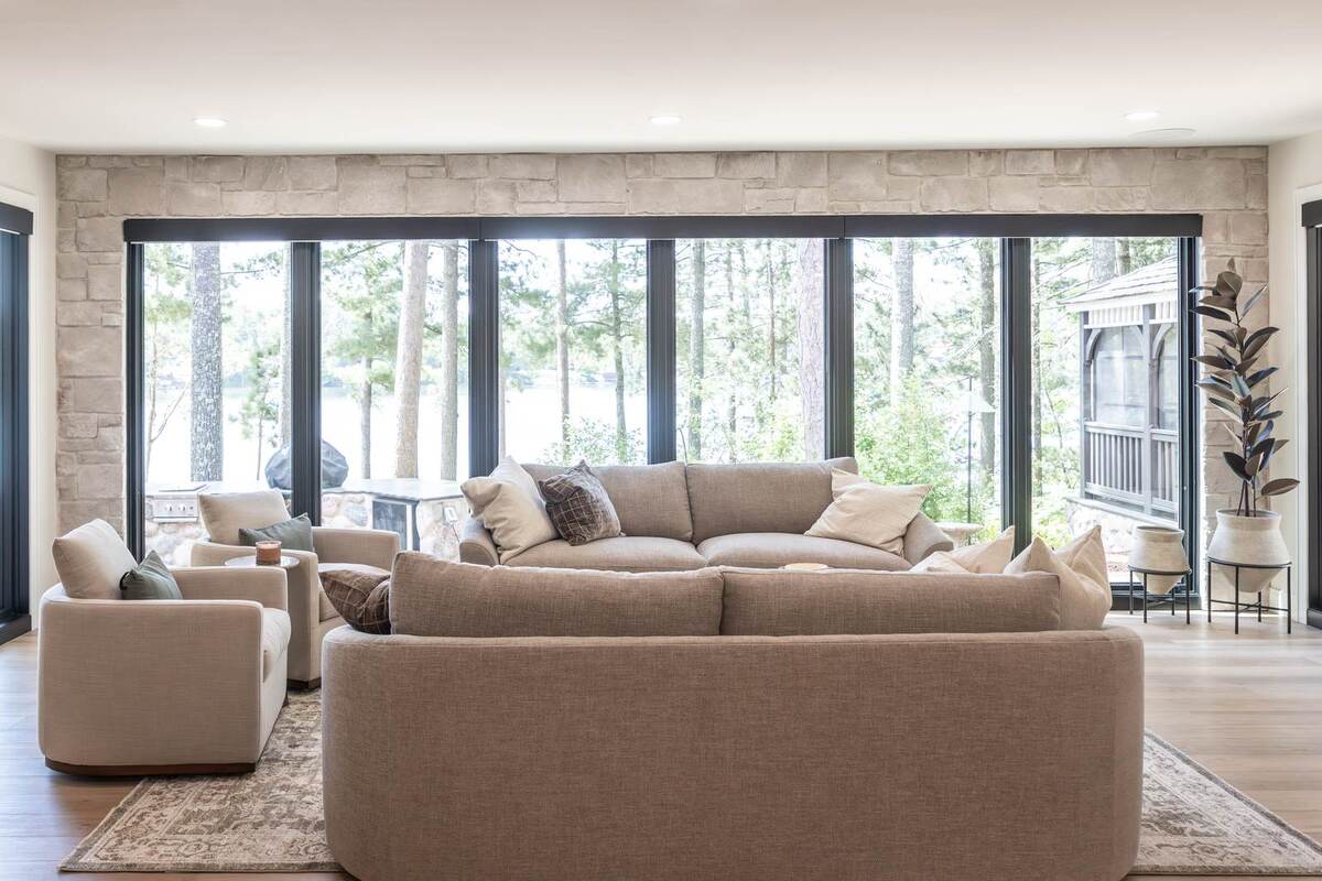 whole home remodel living room with wall of windows and lake view minocqua wi