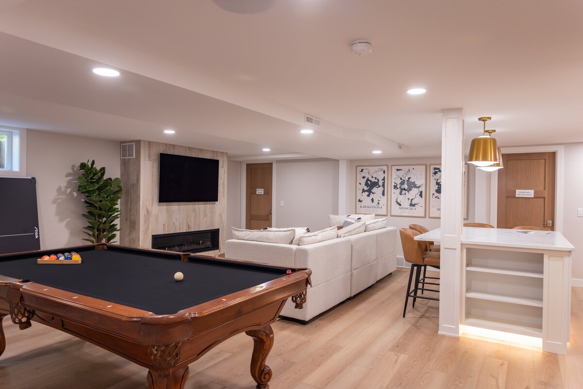 whole home remodel lower level rec room with pool table and linear fireplace minocqua wi