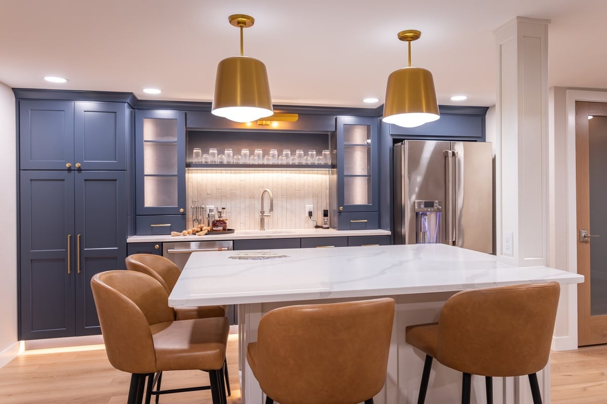 whole home remodel lower level wet bar and quartz peninsula with leather stools minocqua wi