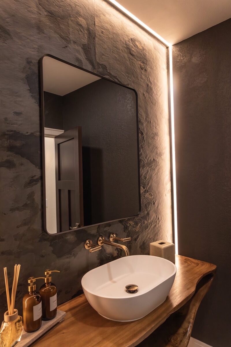 whole home remodel powder room vessel sink and backlit slate wall minocqua wi