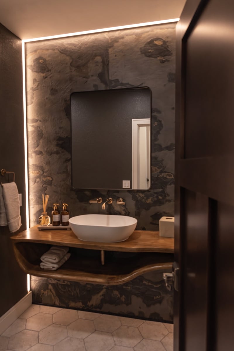 whole home remodel powder room with backlit slate accent wall doorway view minocqua wi