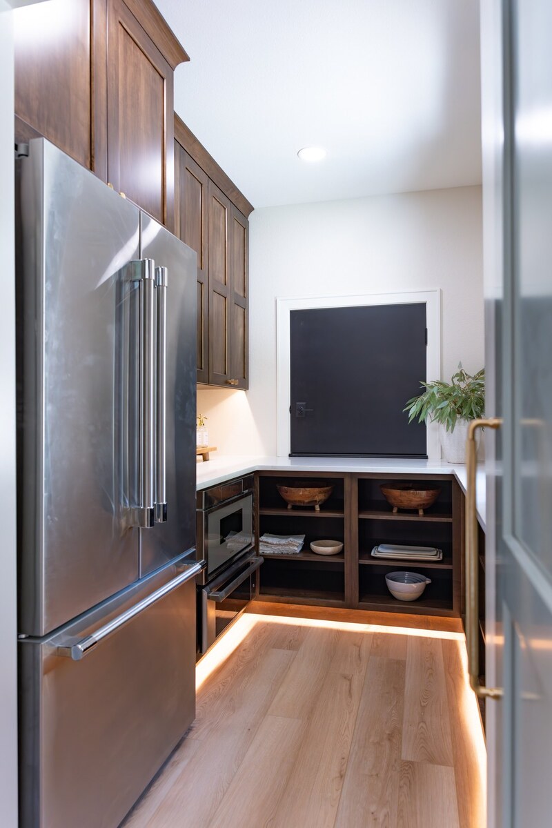 whole home remodel walk-in pantry with refrigerator and toe kick lighting minocqua wi