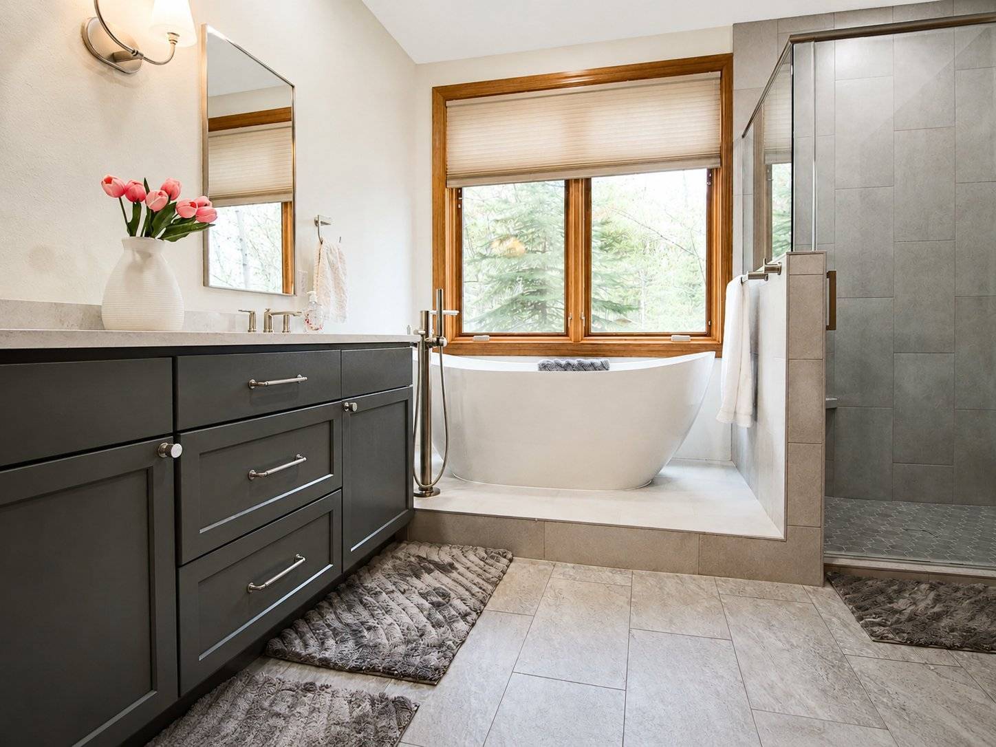 bathroom remodel gray vanity freestanding tub wood window glass shower tulip flowers