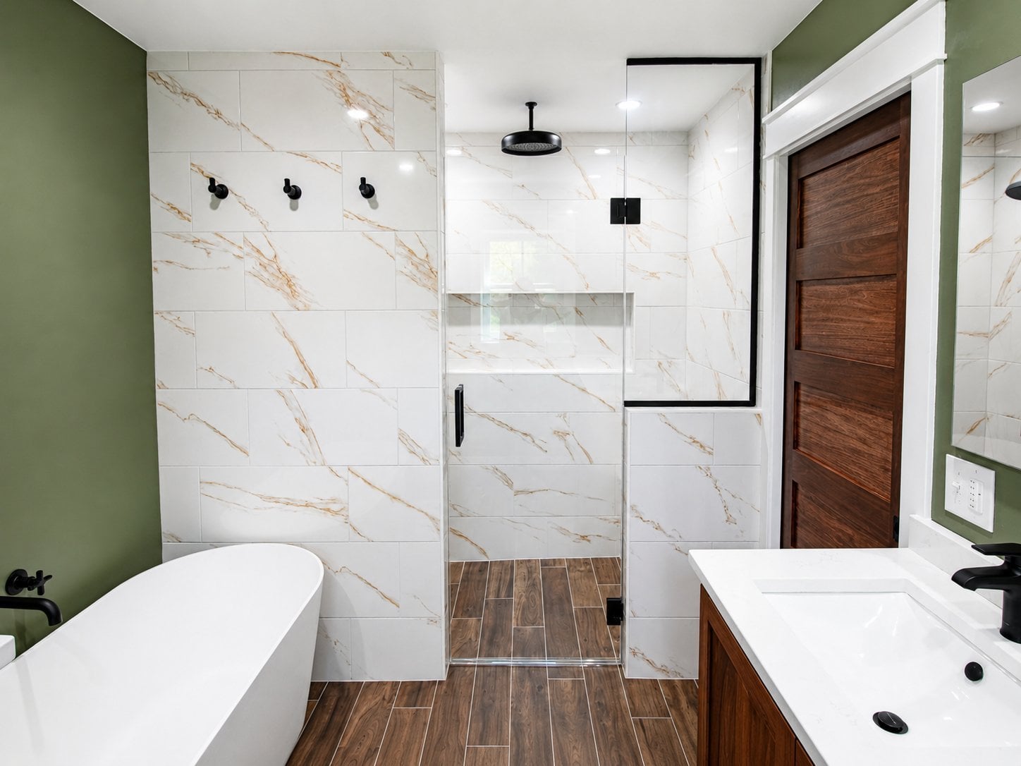 bathroom remodel marble tile shower freestanding tub double vanity wood door