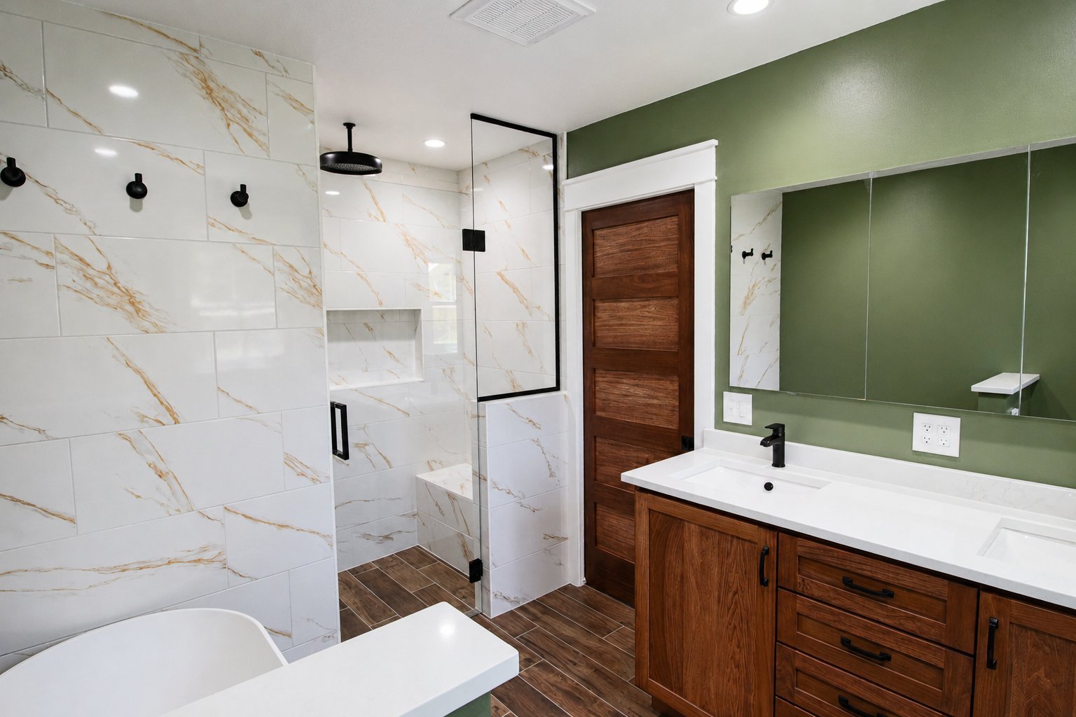 bathroom remodel walk in shower freestanding tub marble tile black fixtures green walls